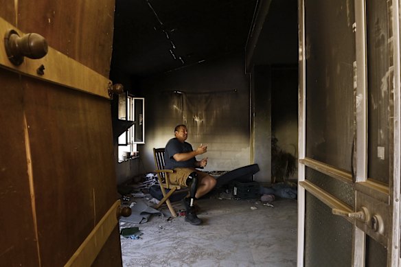 Avida Bahar, who lost his right leg after being shot by Hamas, sits in his home where his wife, Dana, and son, Carmel, were killed and daughter, Hadar, was wounded by Hamas during the October 7 attack on Kibbutz Be’eri.