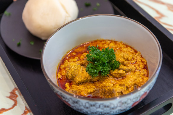 Egusi (soup) with fufu (pounded yam).