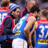 Petracca struggling in pain at quarter-time on Monday.