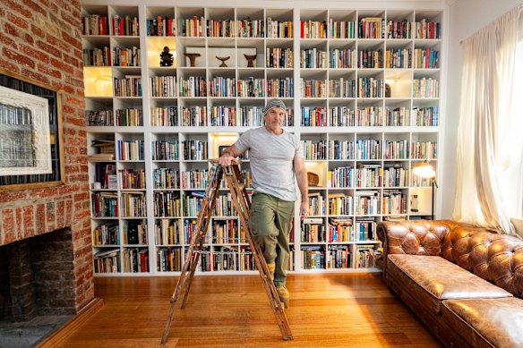 Book collector Kevin Kennedy has some of his first-edition works on show; others are awaiting placement on his shelves.