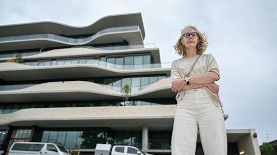 Julie Mulhauser outside Victoria Hill apartments at the corner Burke and Victoria roads, Camberwell.