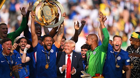 Chelsea players lift the World Club Cup trophy alongside Donald Trump.