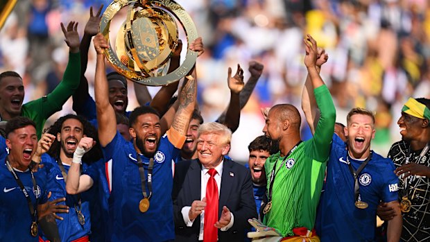 Chelsea players lift the World Club Cup trophy alongside Donald Trump.