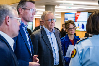 Prime Minister Anthony Albanese gets a briefing from emergency personnel on the flooding situation in NSW with Premier Dominic Perrottet on Wednesday.