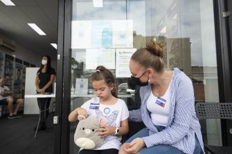 Six-year-old Harper Summer, pictured with mother SJ Rex, received her COVID-19 vaccine in Leichhardt on Thursday.