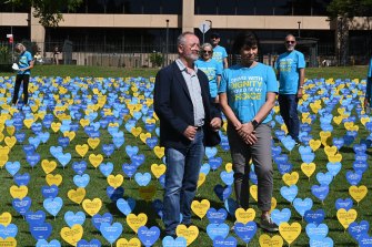 Andrew Denton of Go Gentle Australia standing in the Domain amid thousands of hearts with messages of support for voluntary assisted dying. 