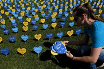 Thousands of hearts with messages of support for voluntary assisted dying legislation in the Domain behind State Parliament in October.