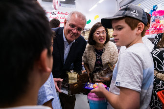 Prime Minister Scott Morrison visits Wallies Lollies in Box Hill South with MP Gladys Liu on Saturday.