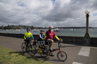 Cyclists Frank Dreyer, Lee Dreyer and Adrian Boss on the Rose Bay Promenade.