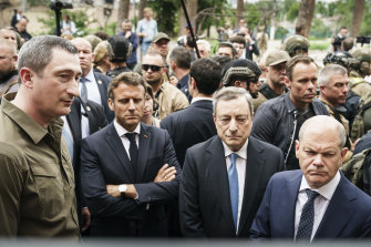 From second from left, France’s President Emmanuel Macron, Italy’s Prime Minister Mario Draghi and German Chancellor Olaf Scholz visit the war-torn Irpin suburb of Kyiv on June 16.