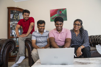 Thinesshan Thevathasan reacts to his  ATAR with his brother Amerthan, father Nadarajah and mother Sivakumari. 