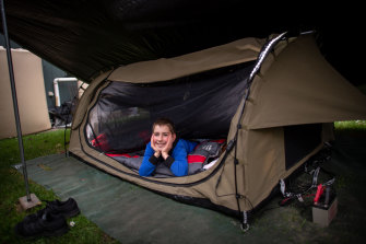 Aidan sets up camp in the backyard.