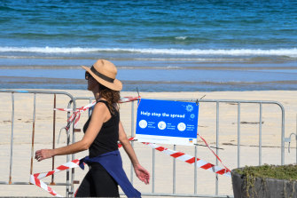 Bondi Beach locals pass a closed beach last week.