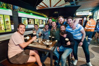 Back on the beers: A group of friends gather outside Jimmy O’Neill’s. 