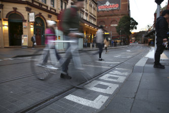 Cyclists face fines for riding along the light rail lines.