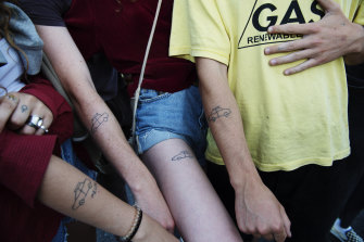 Sarah Rheinberger, Kjell Everingham, Greta Merriman, Aidan Miller from the Blue Mountains gave each other matching tattoos of the car they drove to Byron Bay.