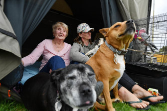 Marian Brandum with her daughter Sally, dogs and pet galah.