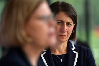 NSW Premier Gladys Berejiklian, with NSW Chief Health Officer Dr Kerry Chant in the foreground. 