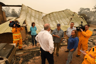 Prime Minister Scott Morrison tours a farm in fire-ravaged Sarsfield, Victoria.