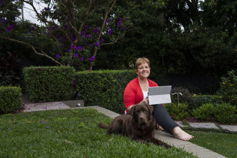 Deputy CEO of ANZ Bank Alexis George working at home in her backyard.
