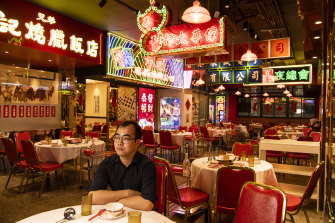 Jack Chen, the manager of Good Luck Hotpot, sits in his empty restaurant. The restaurant industry has been forced to shut down or go takeaway only as a result of coronavirus restrictions. 