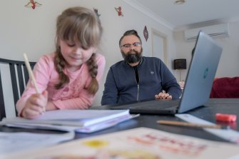 Disability worker David Wragg, at home with his daughter Elissa, has serious misgivings about the quality of her remote education. 