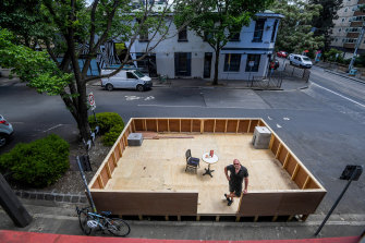 The parklet outside The Everleigh cocktail bar is under construction.