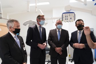 NSW Premier Dominic Perrottet, Health Minister Brad Hazzard and Minister for Western Sydney Stuart Ayres as well as the chairman of Nepean Hospital Peter Collins (far left) take a tour of the newly completed 14-storey clinical services building at the Nepean Hospital.