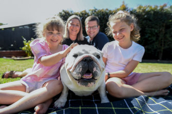Sara and Jamie Strachan and their daughters Isla, 9, and Holly, 6, with beloved British bulldog Maggie. 
