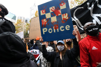 Protesters at a Black Lives Matter rally in Melbourne on Saturday call for an end to Aboriginal deaths in police custody.