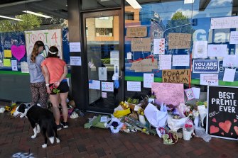 Some of the messages and flowers left outside the Gladesville office of Gladys Berejiklian on Tuesday. 