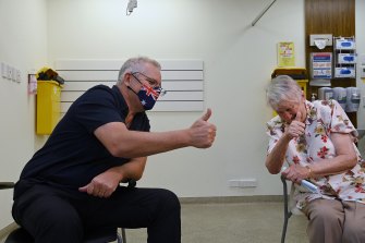 Thumbs up: Scott Morrison received his booster shot with Jane Malysiak in November.