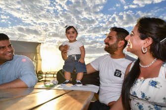 Sabar Kaur Mann, 8 months, with father Manjot Singh Mann, centre right, and mother Navpreet Kaur. 