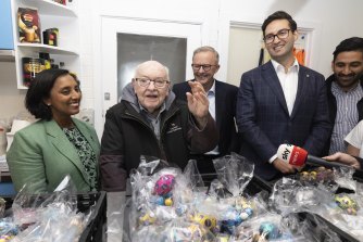 Labor MP Josh Burns (right) on the campaign trail last month with Labor colleagues and Father Bob Maguire. 