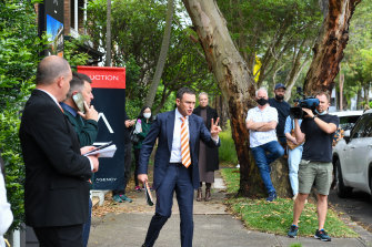 Auctioneer Damien Cooley of Cooley Auctions prepares to sell the home.