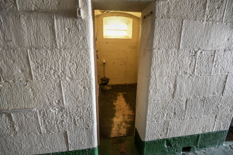 A cell in the 160-year-old A Division with its floor worn down by use.