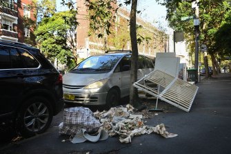 Rubbish and furniture strewn over Darlinghurst Road on Thursday.