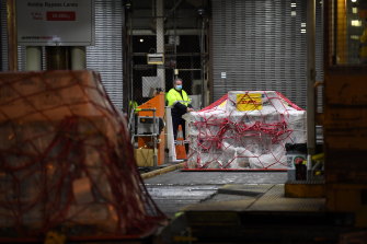 A pallet of Pfizer vaccines is unloaded at the Qantas freight terminal.