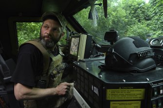 A montanka doll, a good luck charm, hangs from the windscreen of the Bushmaster. 