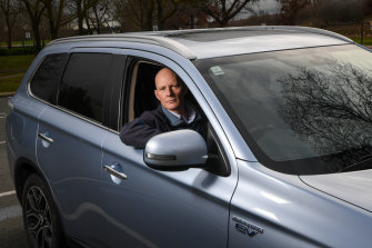 Bruce Gill, hybrid car driver, is being “double taxed” by having to pay both fuel excise as well as the 2 cents per kilometre road user charge on his electric vehicle.