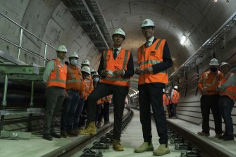 Infrastructure Minister Rob Stokes, left, and Premier Dominic Perrottet inspect a new rail tunnel late last year.