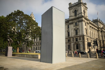 A protective barrier around the statue of Winston Churchill on Parliament Square. 