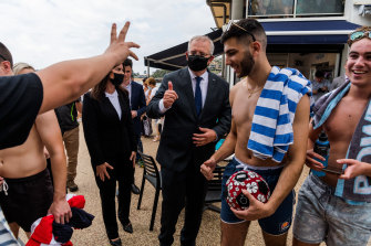 Formidable campaigner: Morrison meets the locals after a visit to the Terrigal Surf Life Saving Club.