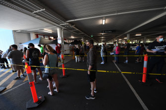 People line up to receive a COVID-19 jab at a Bunnings store in Brisbane.