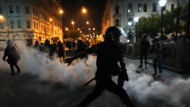 Police use tear gas to disperse protesters in Lima on Sunday night (Monday AEDT).