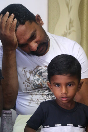 Father-of-three Warnakulasuriya Meril Christopher with one of his children.