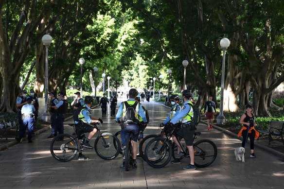 Police patrol Hyde Park on Saturday, to enforce an exclusion zone in place in the CBD.