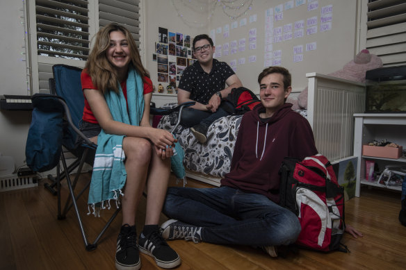 Going bush: Year 12 student Aya Adel at her Annandale home with her friends Oscar Iredale and Peter Jeffries.