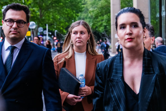 Former Liberal staffer Brittany Higgins (centre) leaves the Federal Court in Sydney this month.