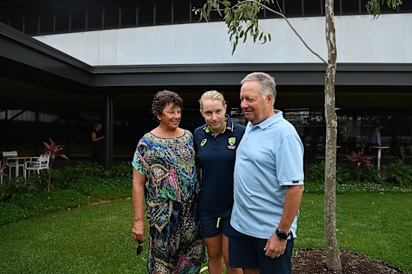 Healy with parents Sandy (left) and Greg after announcing her retirement from all forms of cricket.